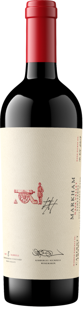 red wine bottle, logo with a man behind a cannon visible, along with a small signature.
