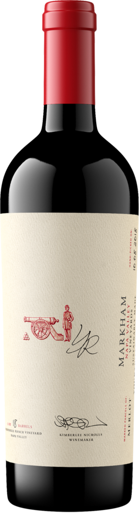 Merlot bottle with logo of a man behind a cannon visible, along with a small signature.