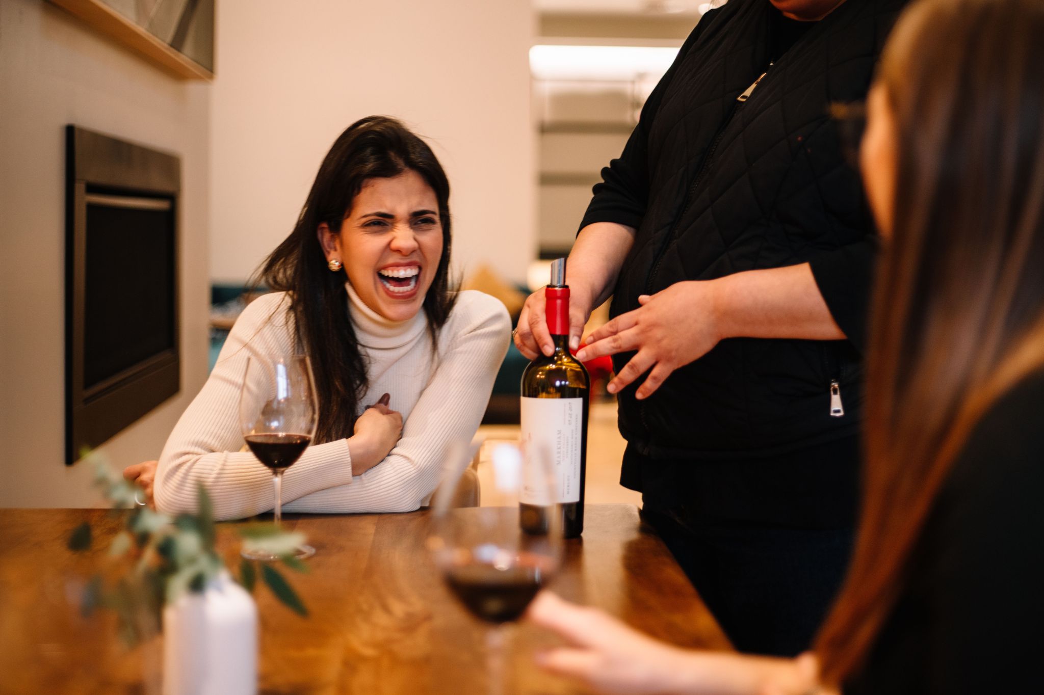 Woman laughing and enjoying her experience at Markham Tasting Room