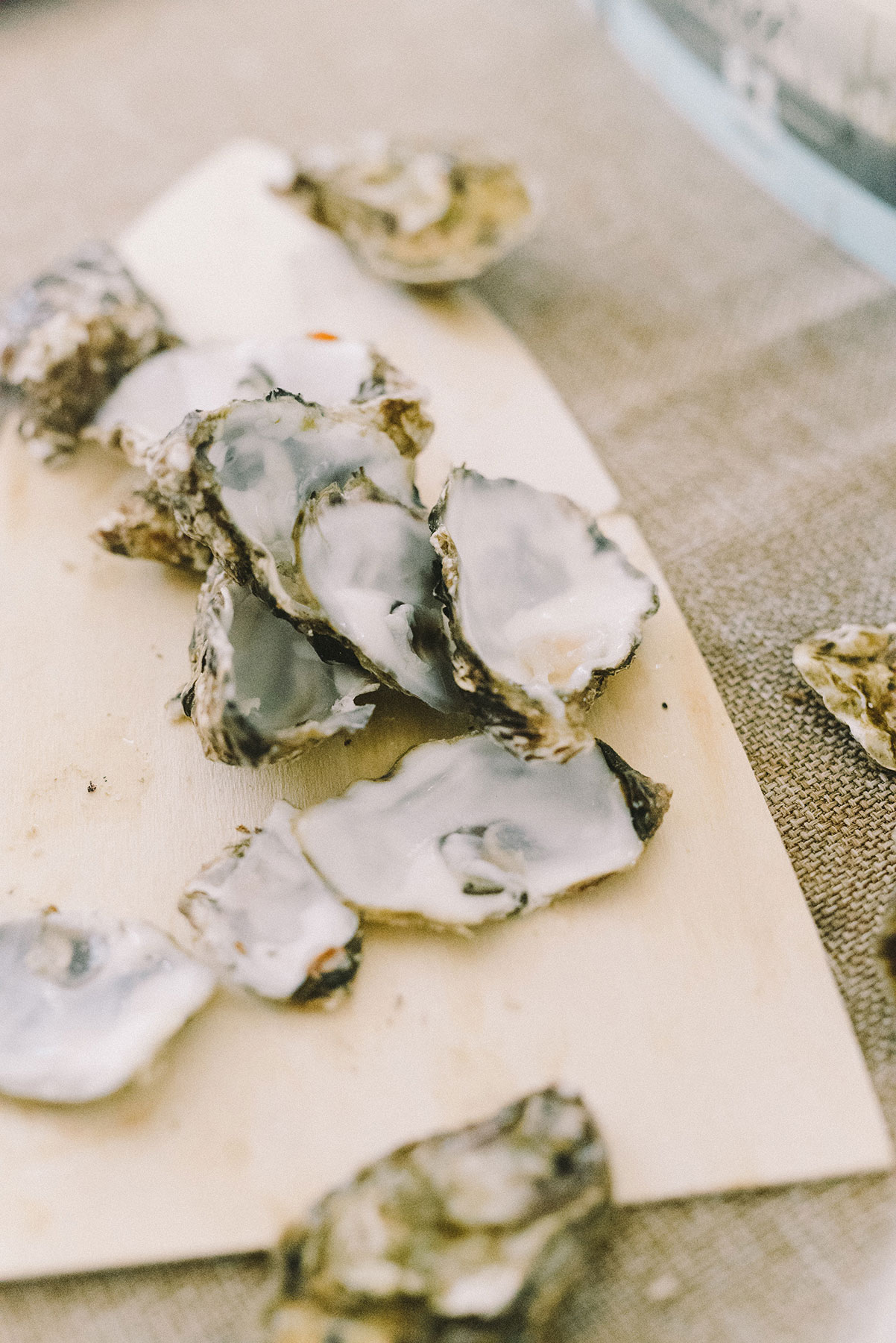 Oyster shells on a wooden serving tray