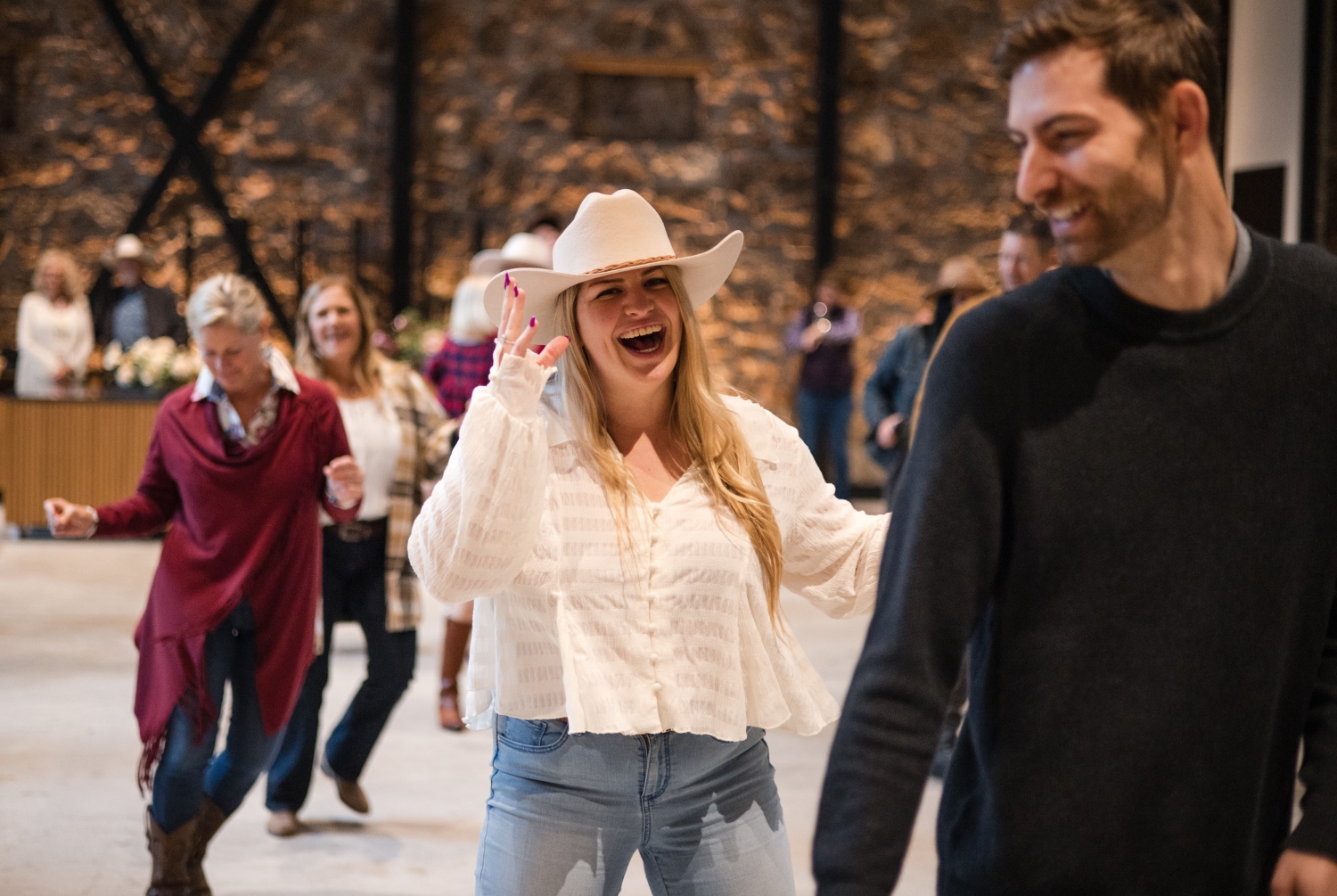 People line dancing in Markham's Historic Cellar