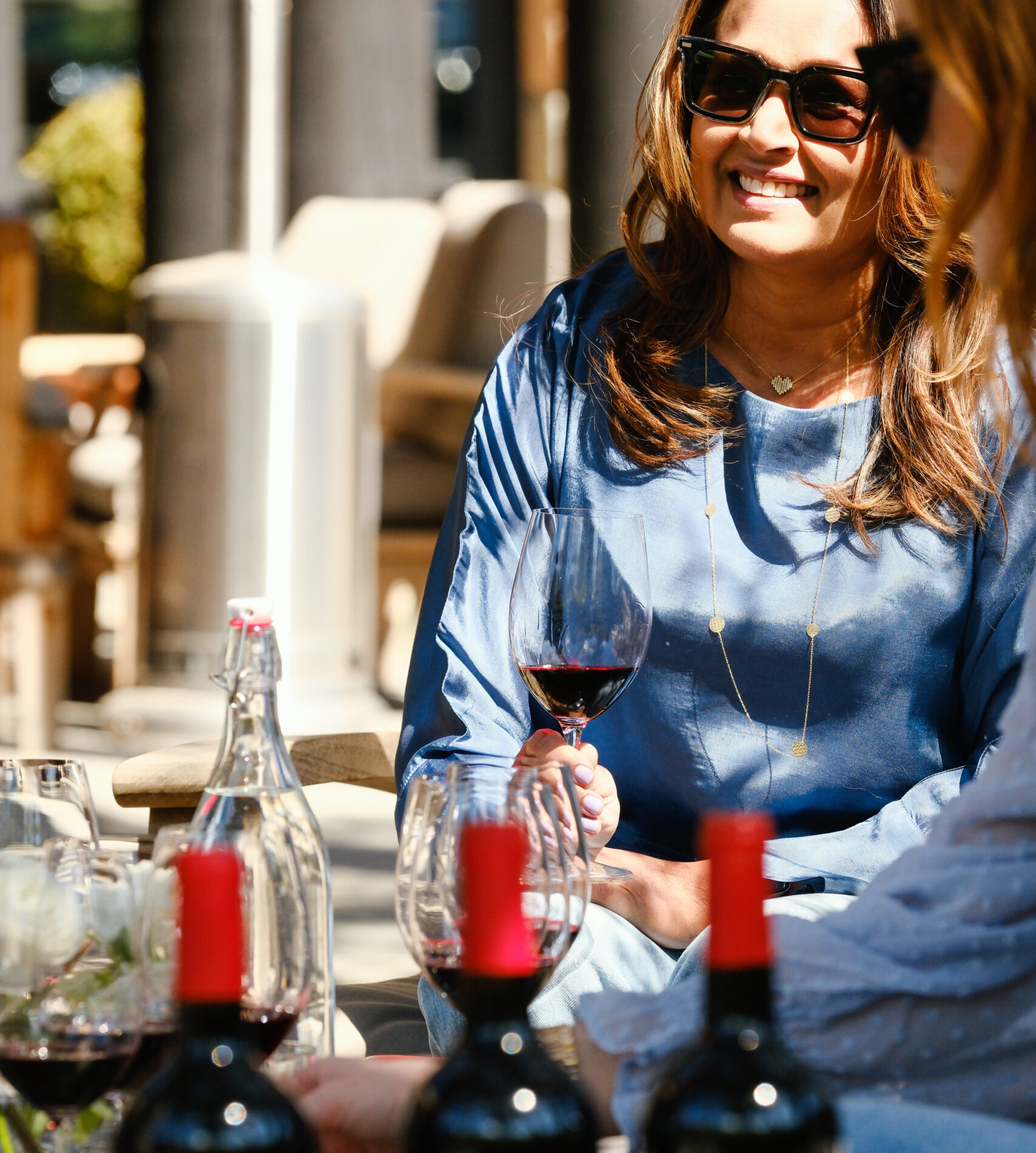 Picture of a person with wine bottles